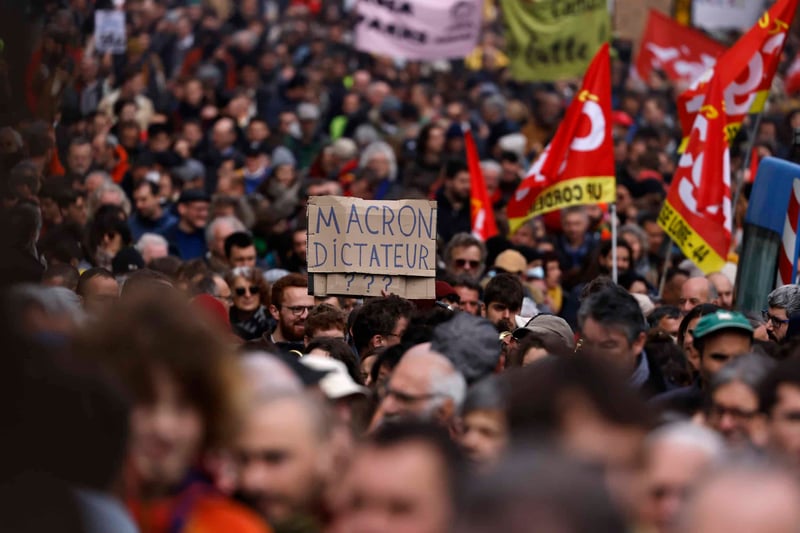 Demonstrators march during a protest against pension reforms in Nantes, France.