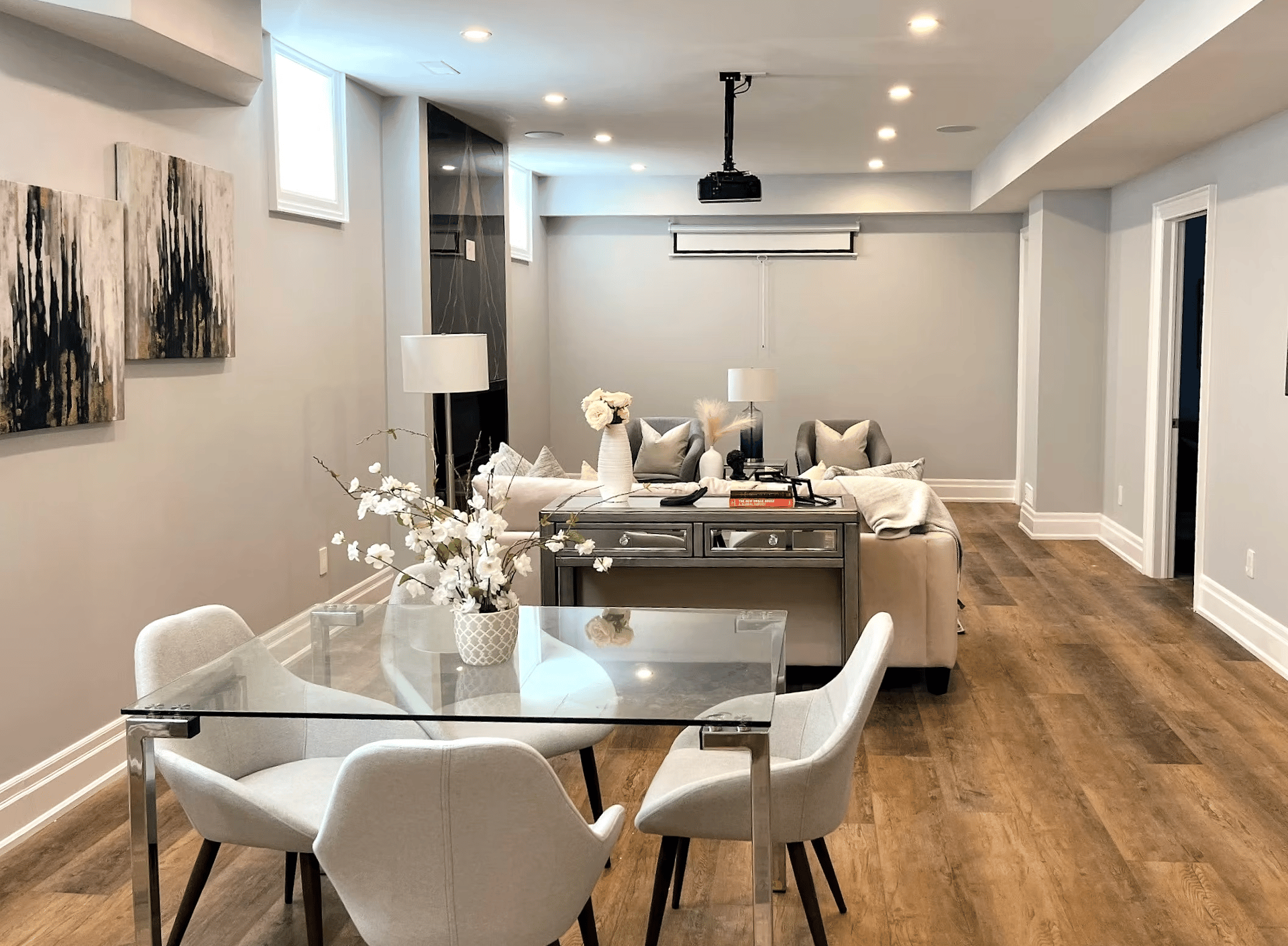 Basement kitchen and bar from an alternate angle with cabinetry and counters