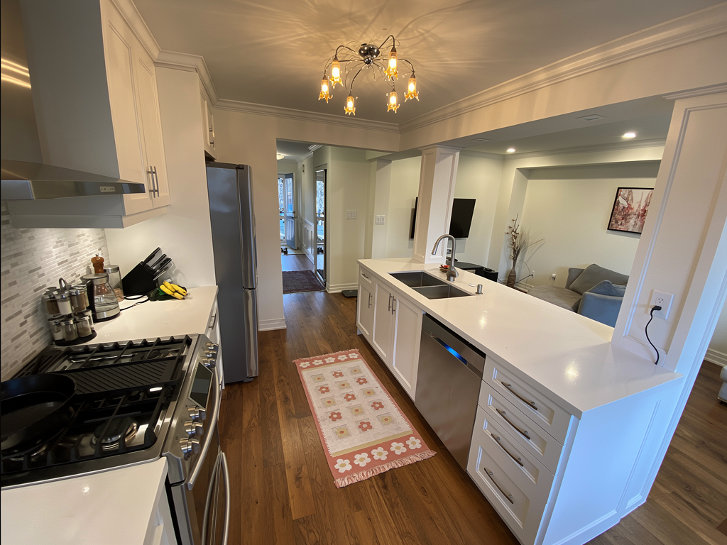 Kitchen renovation finishing details - cabinetry, counters, and trim in a Toronto home