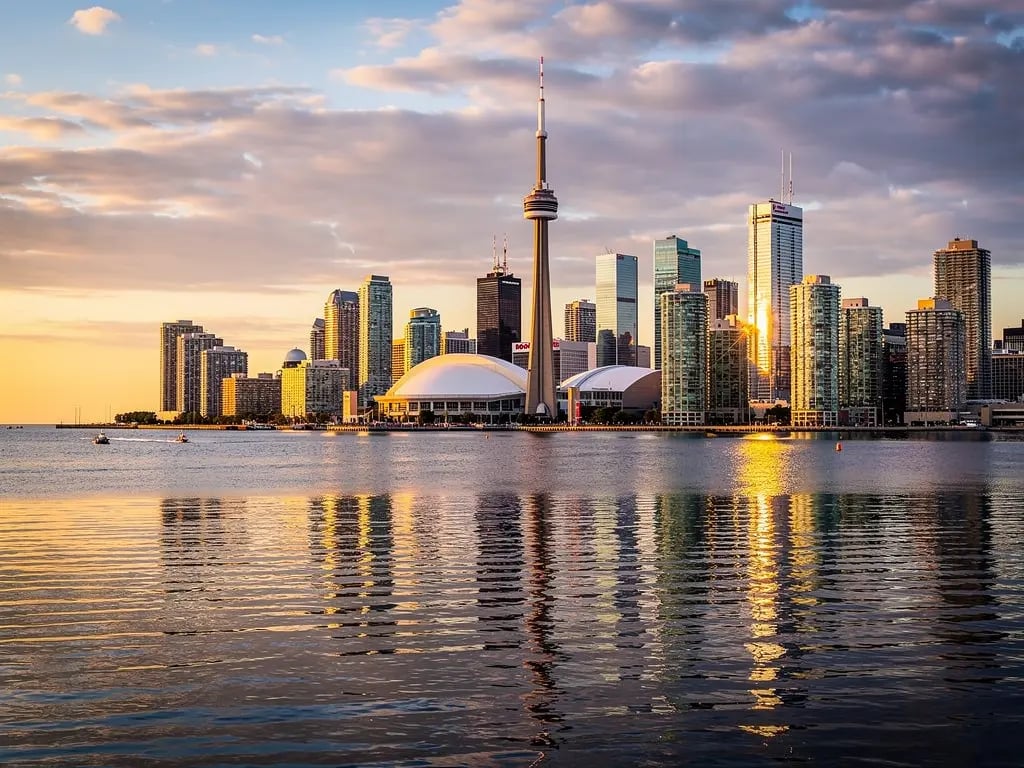 Toronto skyline at dusk over Lake Ontario