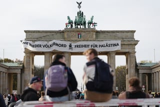 Pro-Palestinian Activists Climb Berlin’s Brandenburg Gate and Unfurl Banner