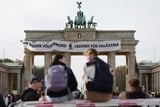 Pro-Palestinian Activists Climb Berlin’s Brandenburg Gate and Unfurl Banner