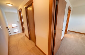 Union Bay Lofts Seattle apartment living area interior with natural light and modern finishes for rent