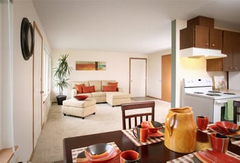 Bright living room in a rental apartment at The Park at Fife, Fife, WA, with modern decor.