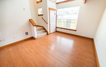 Union Bay Lofts apartment living area in Seattle, WA; bright open layout with large windows and modern finishes.