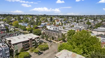 an aerial view of a city with buildings and trees
