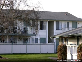 The Park at Fife apartment living room with large window and modern decor in Fife, WA