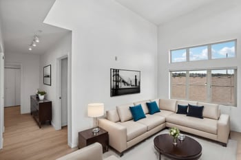 a living room with a couch and a table