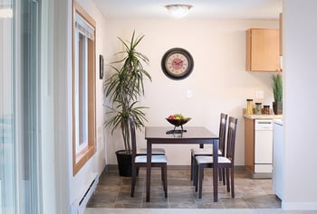 Bright 1-bedroom apartment at Hill Crest Apartments in Tukwila, WA with open living space and modern kitchen.