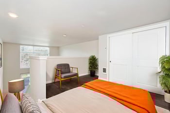 Ludwig Apartments, Seattle: bright living room in a modern rental unit with large windows.