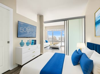 Bright living room in rental apartment at 509 1st Ave, Seattle, WA; large window, neutral decor.