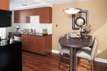Spacious living area with modern kitchen at Champagne at Bellevue apartment, Bellevue, WA