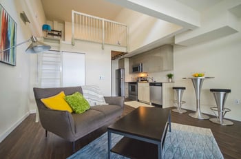 Larson Building rental apartment in Seattle, WA: modern facade, brick exterior, and entry walkway.