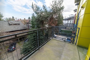 Union Bay Lofts rental living room in Seattle, WA with modern furnishings and ample natural light.