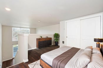 Bright living room at Ludwig Apartments, Seattle, ADA-friendly rental with accessible layout and modern finishes.