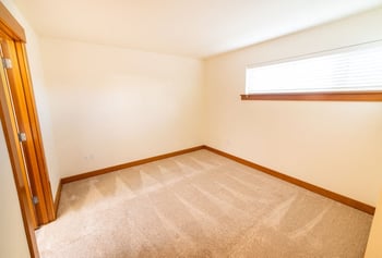 Bright Union Bay Lofts living room in Seattle, 1-bedroom apartment with accessible design and large windows.