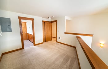 Union Bay Lofts, Seattle rental: sunlit living area with modern finishes and large window.