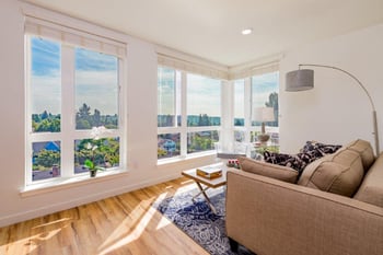 Interior of Lillehammer Apartments rental in Seattle, WA: bright living space with modern kitchen.