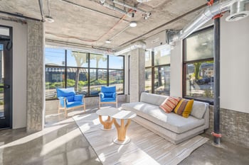 a living room with a couch and two tables