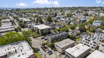 an aerial view of a city with buildings and trees