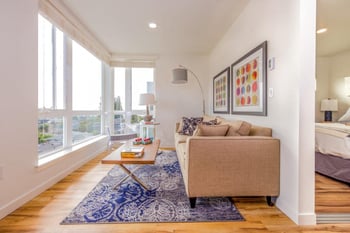 Lillehammer Apartments, Seattle: bright living room with large windows, open layout, and modern finishes.