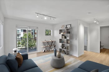 a living room with a blue couch and a rug