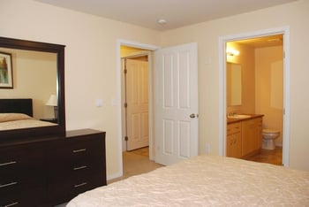 Bright living room at Chianti Apartments, Renton, WA, with large window and neutral decor.
