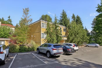 Spacious living room with abundant natural light in Champagne at Bellevue apartment, Bellevue, WA.