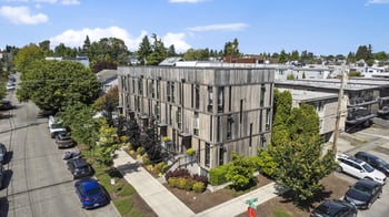 an aerial view of a building in a city street