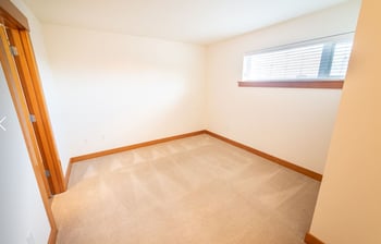 Bright Union Bay Lofts Seattle apartment living room with open floor plan, hardwood floors, and modern kitchen.