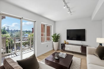 a living room with a couch and a tv