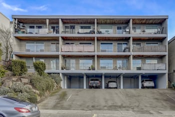 Exterior view of the building with a clear view of its structure and surrounding landscaping.