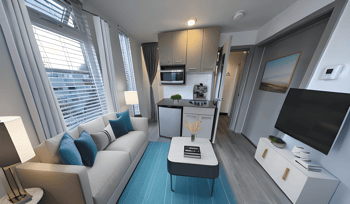 a living room and kitchen in a small apartment