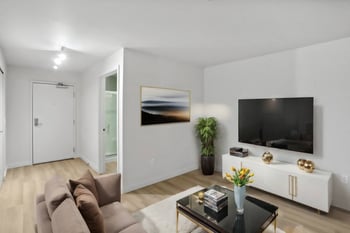 a living room with a couch and a tv