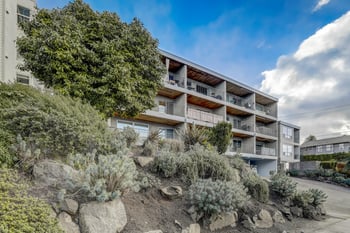 Exterior view of the building with landscaping and architectural details.