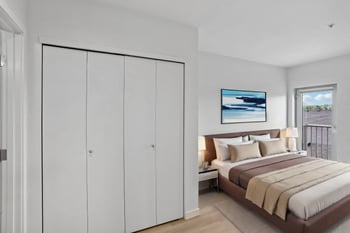 a bedroom with a bed and a large closet