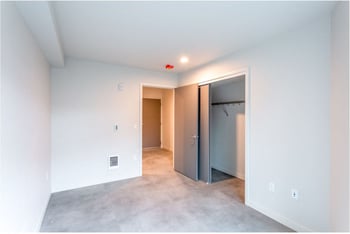 Robins Nest Seattle apartment living room with bright natural light and contemporary furnishings for rent.