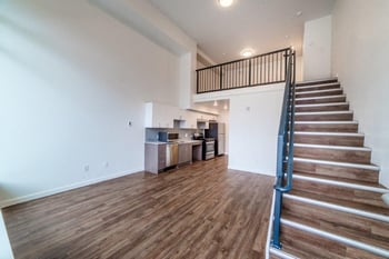 Interior space with stairs and hardwood flooring
