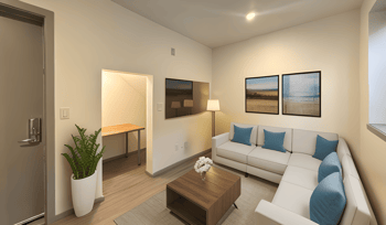 a living room with a white couch and a coffee table