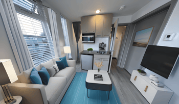 a living room and kitchen in a small apartment