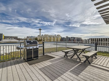 Spacious living room in Seattle apartment at 509 1st Ave; bright, modern rental with updated finishes.