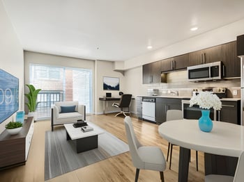 Interior of apartment at 509 1st Ave, Seattle: bright living room, large windows, modern kitchen, hardwood floors.