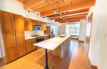 Union Bay Lofts Seattle apartment living area with bright natural light and modern finishes.