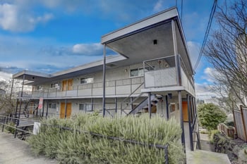 Exterior view of the building with architectural details and landscaping.