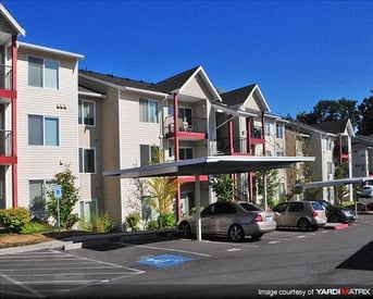 Chianti Apartments, Renton, WA – bright living room with large windows and modern kitchen.