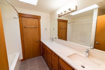 Bright living room in Union Bay Lofts rental apartment, Seattle, WA, with contemporary finishes and natural light.