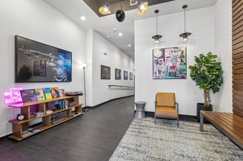 Discover vibrant common areas at Ludwig Apartments in Seattle, WA. Enjoy modern art, comfortable seating, a unique record display. Pet-friendly apartments ne...