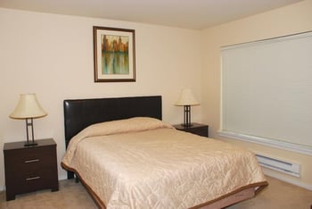Bright, accessible living room at Chianti Apartments, Renton WA; modern finishes and open kitchen.