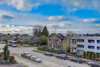 Aerial view of the building and its surroundings, including streets and nearby areas.