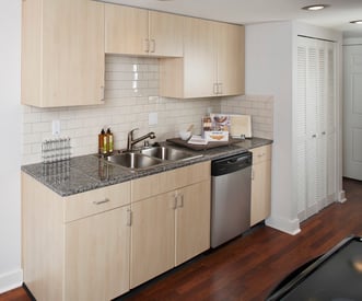 Bright living room of a Champagne at Bellevue apartment in Bellevue, WA with large windows and modern finishes.